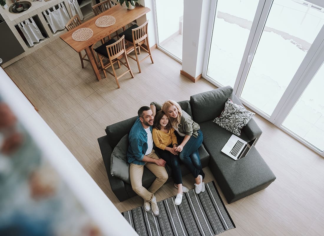 Personal Insurance - View from Above of a Family with a Daughter Enjoying Their Time Together Sitting in the Living Room